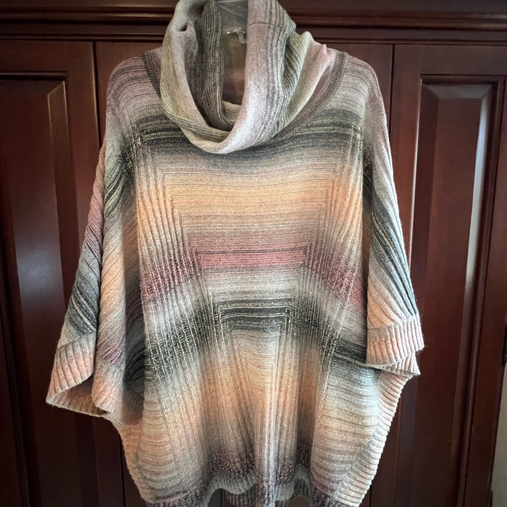 Boutique sweater/poncho combination. Beautiful and fun!